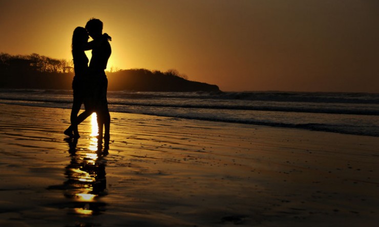 Couple on Tamarindo beach at sunset